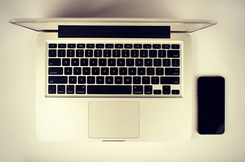 A person using a laptop to browse stock photo websites. Freelancing work in a cozy setting.